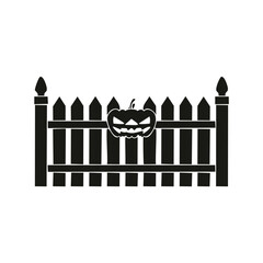 Halloween pumpkin on a picket fence silhouette vector