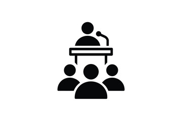 Speaker addressing an audience at a podium with microphone