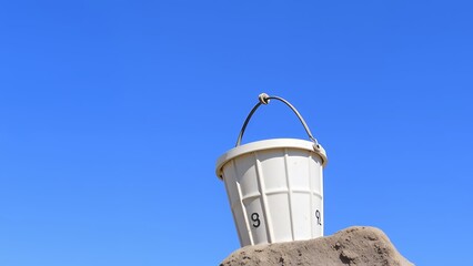 Whimsical Trash Can Elevated on Mound