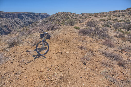 A bicycle parked near the abandoned Richinbar Mine in the Agua Fria National Monument, Arizona, USA - Powered by Adobe