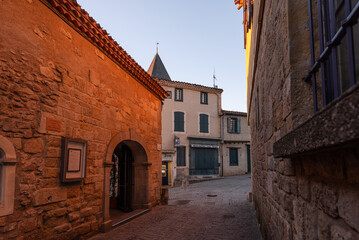 Warm sunset glow on historic houses in the lower town of Carcassonne near Rue Trivalle