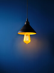 Hanging lamp with warm light and blue background promoting emotional design and simplicity
