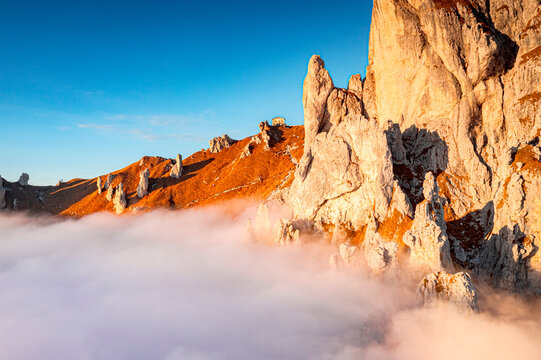 Rifugio Rosalba and Grignetta (Grigna Meridionale) in autumn fog, Lake Como, Lombardy, Italy