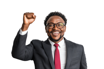 Cheerful man in a suit celebrating success with a raised fist and a smile, isolated on white background.