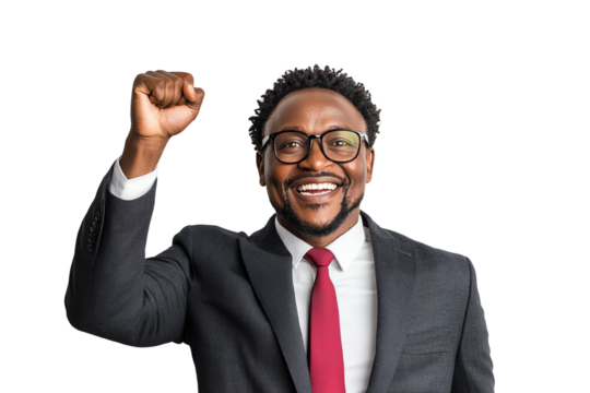 Cheerful man in a suit celebrating success with a raised fist and a smile, isolated on white background.