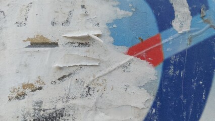 Fototapeta premium Torn and ripped street poster background, old paper texture on metal wall