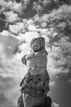 Monochrome view of Marble statue of a Triton from the Odeion of Agrippa in the Ancient Agora of Athens, Greece.