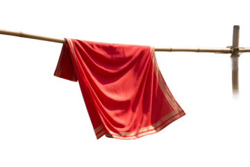 Red Sari Drying in Sunlight on Bamboo Pole