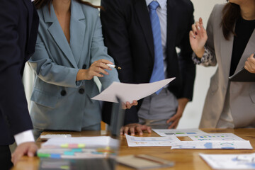 Business meeting, coworkers are discussing in the conference room. Group of business colleagues are discussing and sharing business planning ideas with colleagues.