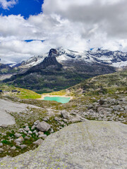 Austria, 08-2025 : wide shot of Weißsee lake, mountains and glaciers in background. Shot from a hiking mountain path.