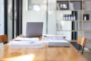 Work desk and documents in conference room at office.