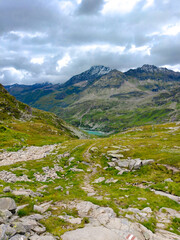 Austria, 08-2025 : wide shot of Weißsee lake, mountains and glaciers in background. Shot from a mountain hiking path.