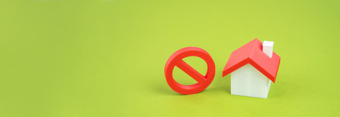 Residential buildings and red prohibition symbol No. Restrictions ban on construction. Inaccessible expensive housing. Restriction building compaction. Underdeveloped infrastructure. banner copy space