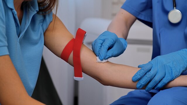 Healthcare Professional Preparing for Blood Collection Procedure Carefully