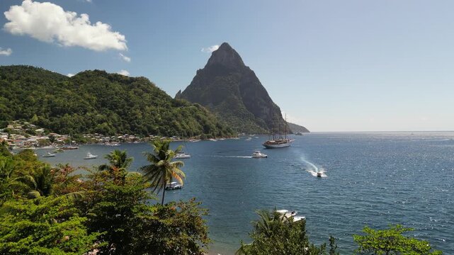 Zoom in Drone shot of castries harbor, in the background the pitons (mountains).
