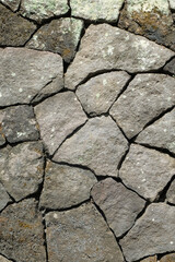 Natural stone wall pattern and texture vertical background. For graphic design and banners