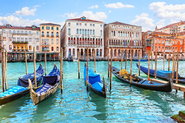 Gondolas on Grand canal in Venice, Italy. View of the beautiful Grand Canal in Venice, with palaces, gondolas and boats.