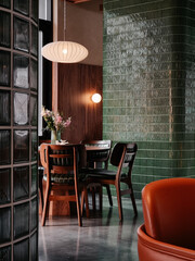 Cafe interior: wooden table and chairs near green tiled wall and glass window. Empty dining room, designed in mid-century modern style with lots of wooden elements, green tiles and glass blocks.