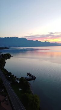 Serene waterscape w/ mtns at dusk