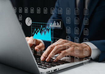 Business hands on laptop—data, documents, and smart decisions.