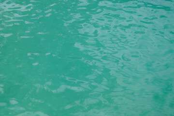 Turquoise green river water surface ripple texture background. Ecological and environmental concept. For graphic design and banners