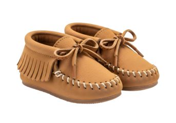 A pair of brown suede moccasins with fringe and laces isolated on transparent background, perfect for a childs comfortable and stylish footwear option