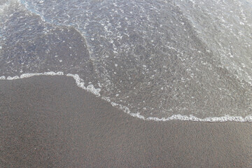 Ocean wave at black sand beach on Tenerife, Canary islands, Spain
