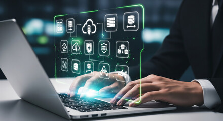 Closeup of a businessmans hands on a laptop keyboard, with a glowing holographic cloud computing interface showing various service icons
