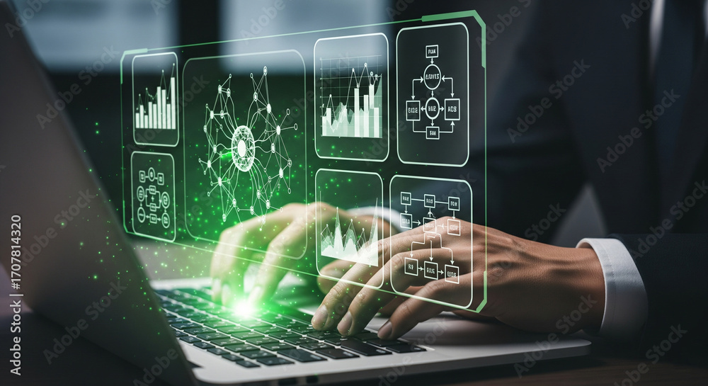 Wall mural a person using a laptop with a dynamic holographic display showcasing various data charts and workfl