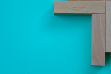 Wooden blocks arranged in the shape of the letter 