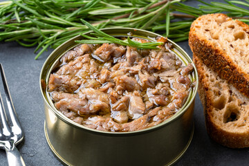 Canned tuna in brine isolated on black background	