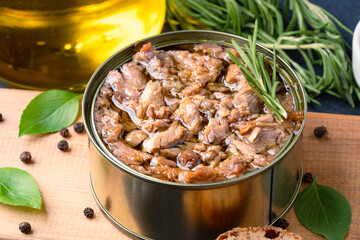 Canned tuna in brine isolated on black background	