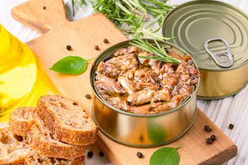 Canned tuna in brine isolated on white wooden background	