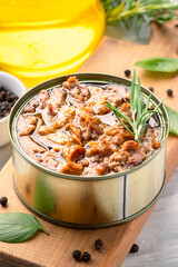 Canned tuna in brine isolated on white wooden background	