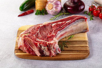 Raw prime beef steak with bone