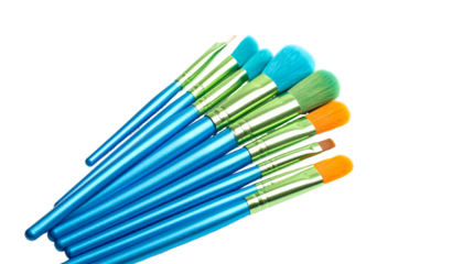 Colorful Makeup Brushes on White Background.