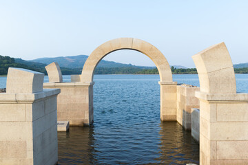 Roman arch of Aquis Querquennis submerged in the lake. Ourense, Spain