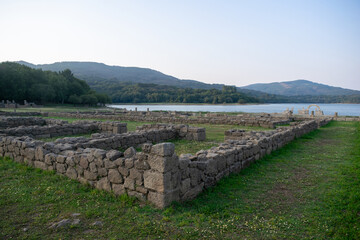 Roman ruins of Aquis Querquennis in Ourense, Spain, near the Limia River. An ancient archaeological site with stone walls, historical heritage, and a picturesque natural landscape.