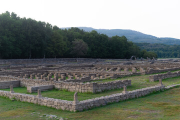 Roman ruins of Aquis Querquennis in Ourense, Spain, near the Limia River. An ancient archaeological site with stone walls, historical heritage, and a picturesque natural landscape.