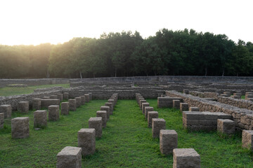Roman ruins of Aquis Querquennis in Ourense, Spain. Archaeological site with various stone structures.