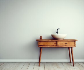 A mid-century modern wooden vanity with a simple white sink sits against a light gray wall, highlighting a calm and minimalist aesthetic.