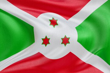 Dynamic rippling fabric of the Burundi flag, representing unity, heritage, and the essence of...