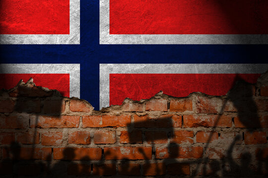 Norway flag painting on brick wall and Protesters shadow