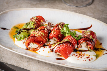 Roasted red peppers stuffed with cheese and herbs.
