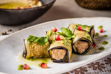 Eggplant rolls stuffed with walnuts and herbs.