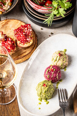 Assorted Georgian pkhali with wine and pomegranate.