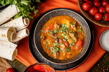 Traditional Georgian beef stew with vegetables and herbs.