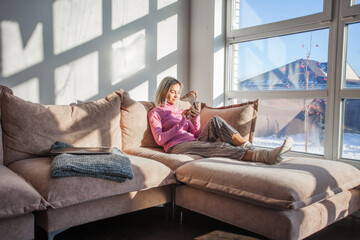 Indoor shot of charming friendly middle-aged woman