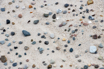 Pebbles on the beach as a background, closeup of photo