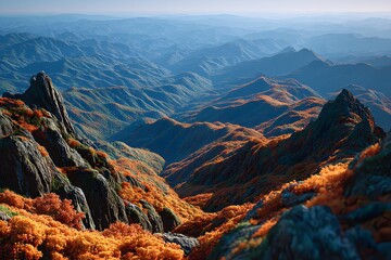 Mountain ridge panorama with layered ranges and glowing sunset light, dramatic background for travel agencies, outdoor sports and motivational visuals